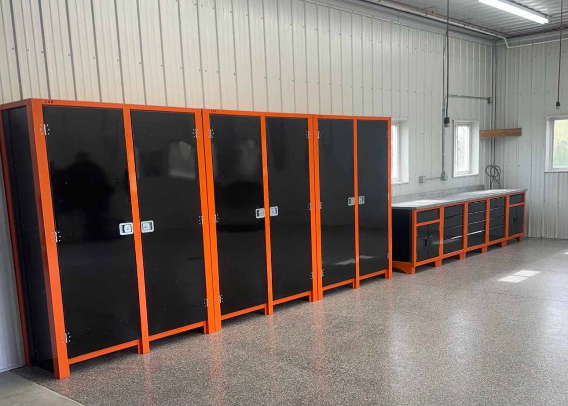 wide black storage cabinets with orange strip in a warehouse